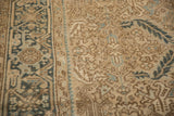 Evenly worn pile showing the Turtle Samovar border design in sand and dusty blue hues.