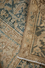 The hand-knotted foundation and low, even pile of a distressed Persian Heriz carpet.