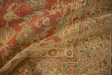 Distressed texture and faded palmette and vine motifs in cherry red, beige, and slate blue.