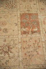 Distressed vintage Tabriz detail: pictorial panel with birds, trees, and worn ivory, rust hues.