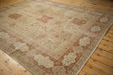 Distressed Tabriz carpet section with chestnut rust border and inscribed antique ivory cartouches.