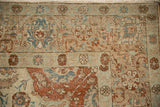 Corner view showing the mostly even wear and visible knot heads of a distressed vintage Tabriz.