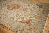 Corner of a vintage Tabriz showing textured wear, with terracotta palmettes and seafoam vines.
