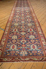 The full length of a vintage Malayer runner, showing the allover henna design in gem-like tones.