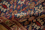 The soft fold of a vintage Persian Malayer rug reveals its short pile and geometric design.