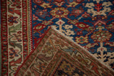 Detail of the hand-knotted back and rich, gem-toned pile of a vintage Malayer runner.