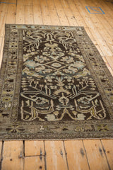 Vintage distressed Mehriban rug, detailed geometric floral field in charcoal, dusty blue, and ivory, with even wear.