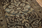 Detail of distressed vintage Mehriban rug: faint foundation, charcoal, dusty blue floral motifs.
