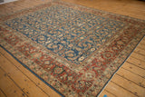 Corner of Afghani Mahal carpet, displaying rust Samovar Turtle border and sapphire Herati field.