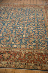 Angled view of Afghani Mahal carpet's sapphire blue Herati motif and rust Samovar Turtle border.