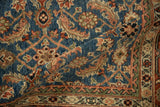 Hand-knotted pile of Afghani Mahal rug featuring sapphire blue Herati motif and geometric border.