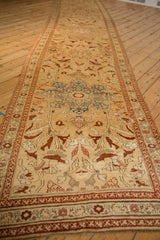 Detailed view of antique Karabagh runner's starburst medallion, dusty apricot, slate blue, and burgundy.