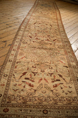 Side border detail of the antique distressed Karabagh runner with expressive plant motifs.