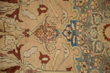 Antique distressed Karabagh rug with time-softened apricot, burgundy, and powder blue floral motifs on short pile.