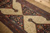 Close-up of antique Persian Serab runner's intricate Herati motifs and tone-on-tone camel ground.