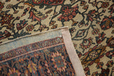 Back of an antique Farahan Sarouk showing its hand-knotted foundation and restored side cord.