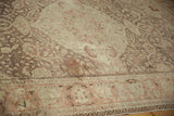 Angled view revealing the distressed pile and heavy abrashes on the vintage Kayseri carpet.