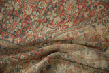 Distressed vintage Mahal rug pile displays ruby red, ivory, and sapphire blue floral motifs.