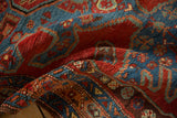 Substantial body and dense hand-knotted pile of an antique Persian Heriz rug runner.