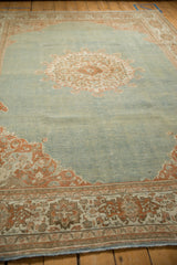 Close-up view of the distressed, low-pile texture on a vintage Meshed carpet.