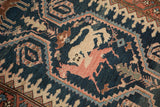 Stylized cheetah and deer in a pictorial hunting scene on an antique Persian Malayer runner.