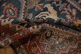 Detail of a pictorial hunting scene with a horseback rider on an antique Malayer runner.