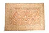 Vintage distressed Kashan carpet with sprawling arabesques in faded brick red, ivory, and sapphire blue.