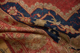Rich red, cobalt blue, and beige abrash on the folded pile of a vintage Oushak rug.