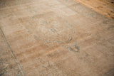 Vintage Distressed Tabriz carpet: aged beige pile and faint seafoam blue curvilinear motifs.