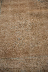 Distressed vintage Tabriz carpet texture, showing low pile, visible foundation, and subtle seafoam blue.