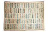 Afghani Moroccan design carpet with a shaggy pile featuring abstract striped columns in blue, rose, and brown.