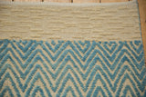 Abstract modern Afghani rug, pale turquoise chevron pile and cream geometric textured weave.