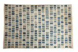 Afghani modern abstract rug, geometric blocks in ivory, dusty blue, teal, and silver.