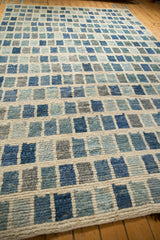 Textured hand-knotted Afghani modern carpet, ivory grid with offset blue and silver blocks.
