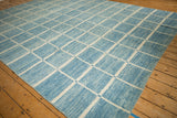 Powder and sky blue modern geometric grid pattern with ivory lines and striations.