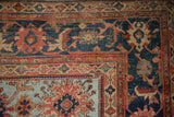 Antique Persian Sultanabad carpet corner with navy Herati border and powder blue field palmettes.