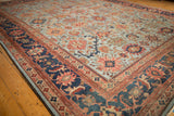 Antique Sultanabad corner detail: powder blue field, serrated palmettes, oversize navy Herati border.