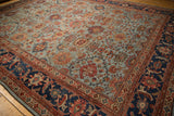 Antique Sultanabad carpet corner: navy border with oversize Herati motif, powder blue palmette field.