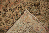Detail of the hand-knotted foundation and distressed pile of a vintage Persian Malayer rug.