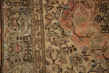 Worn pile showing knot heads and heavy abrashes in brown, silver, and terracotta hues.