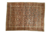 Vintage distressed Tabriz carpet with an allover Herati design in charcoal, cochineal red, and dusty green-gold tones.