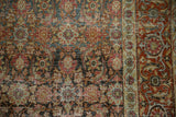 Close view of a distressed Tabriz carpet's pile, detailing the Herati and Turtle Samovar motifs.