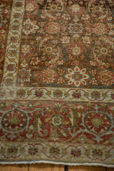Distressed low pile texture on the Turtle Samovar border of a vintage Persian Tabriz carpet.