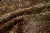 Softly folded vintage Tabriz carpet showing distressed low pile and muted Herati pattern.