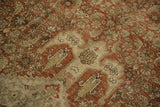Detail of the worn Herati field and bat-like finial on a distressed antique Bijar carpet.
