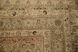 Corner spandrel of an antique Bijar carpet showing its hand-knotted texture and low, even wear.