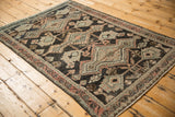 Decorative distressed geometric patterns in charcoal, dusty cantaloupe, and pale brown.