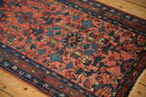 Vintage Mehrivan rug's blush red field with sapphire blue geometric arabesques and bird motifs.