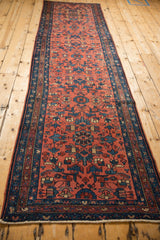 Vintage Mehrivan runner detail shows blush red field with geometric arabesques and sapphire blue motifs.