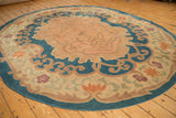Close-up of Chinese Arts and Crafts scrolling vines, tangerine and mauve blossoms.